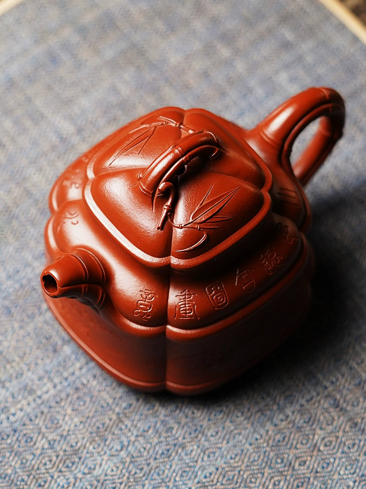Yixing purple clay Qian Qi carved Sifang bamboo tripod teapot